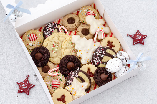 A 24-count holiday cookie box featuring a festive mix of seasonal flavors. Freshly baked in Darien, WI for holiday gifting, parties, and family celebrations. Pickup and delivery available.