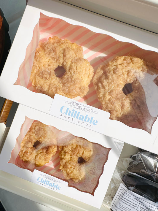 Packaged donuts with 'Chillable Bake Shop' label on a white surface.
